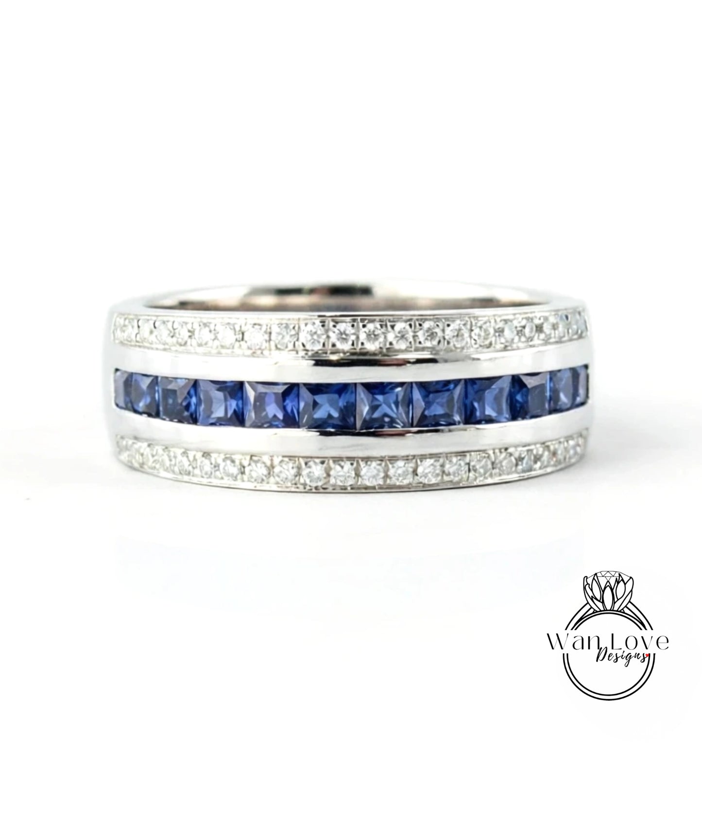 A silver ring with a row of blue sapphire gemstones set in a band.