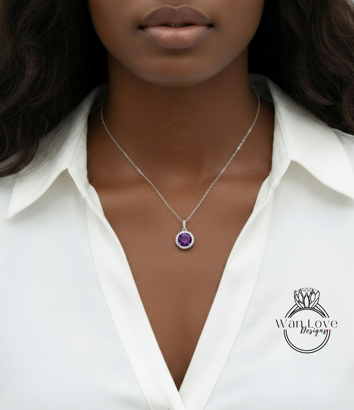 A close-up of a woman wearing a white blouse and a necklace with a purple gemstone pendant.