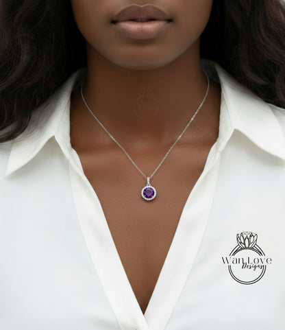 A close-up of a woman wearing a white blouse and a necklace with a purple gemstone pendant.