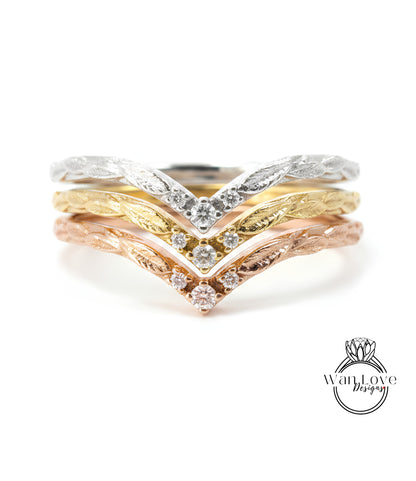 A close-up image of a ring with three distinct layers of rings, each with a unique design and color.
