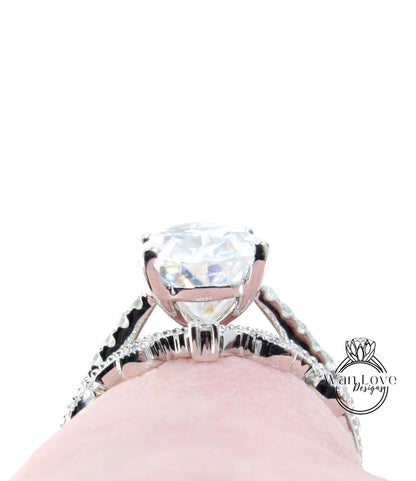 A close-up view of a large, sparkling diamond engagement ring on a person's finger.