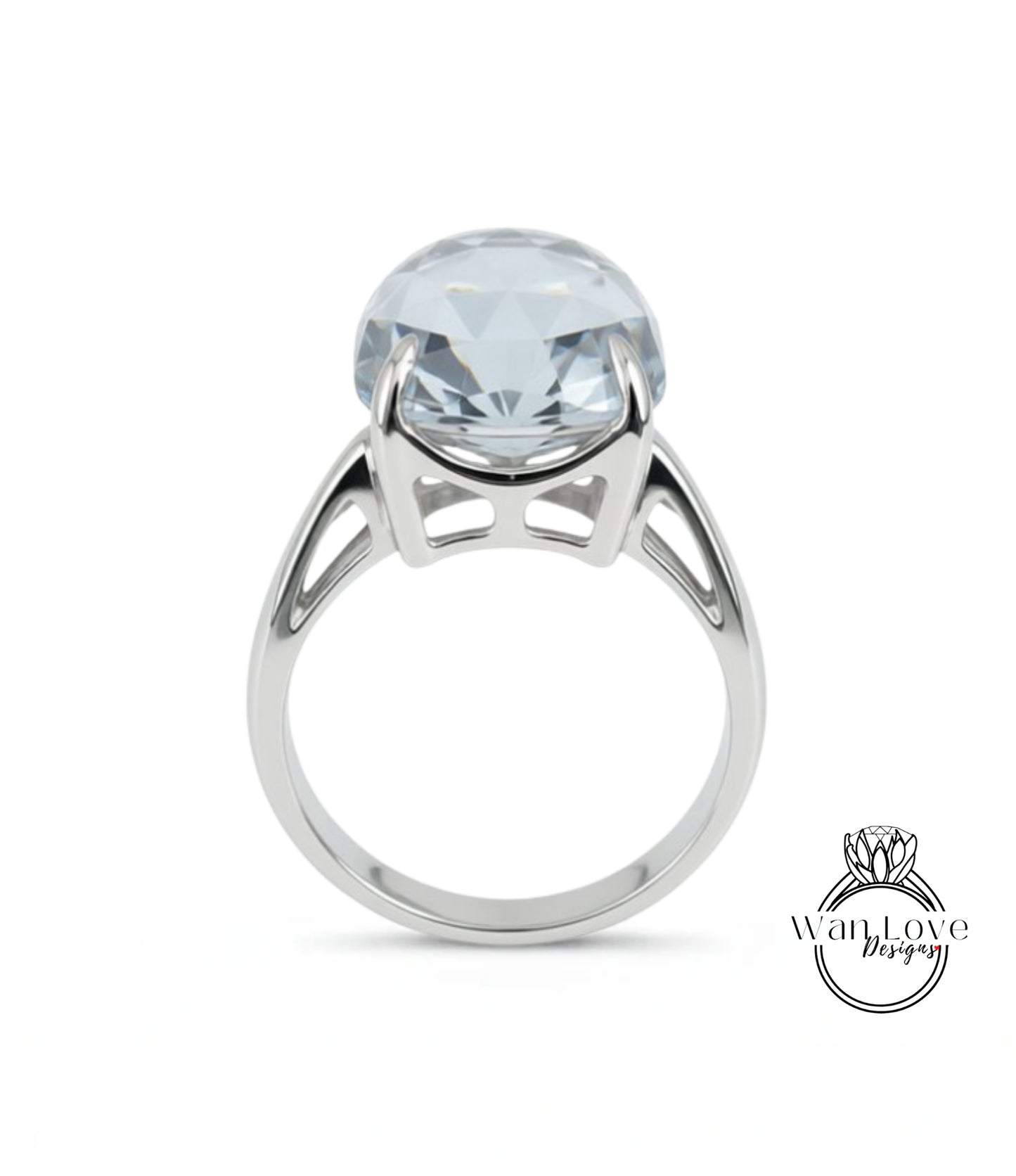 A silver ring with a large, clear gemstone set in the center.