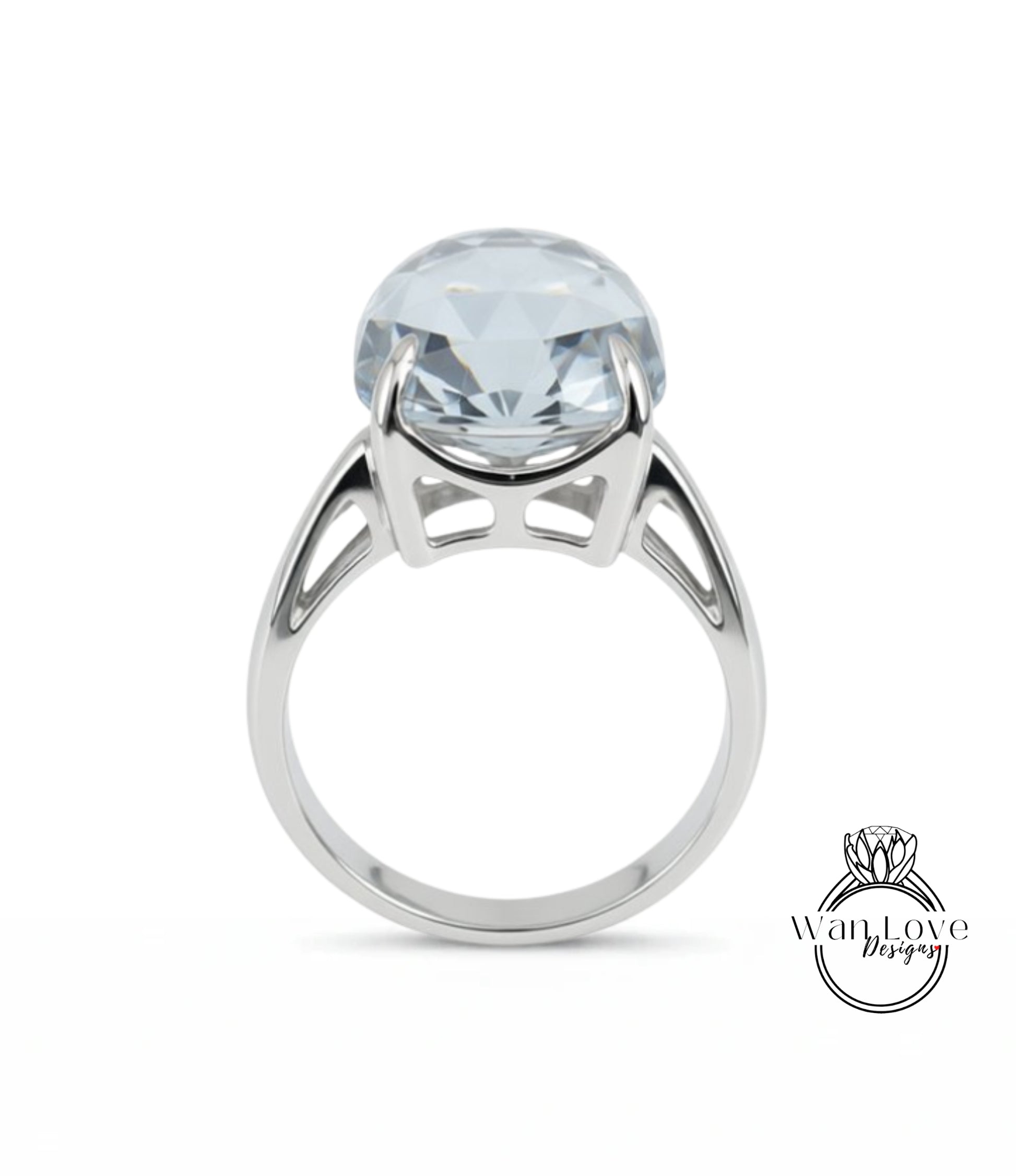 A silver ring with a large, clear gemstone set in the center.
