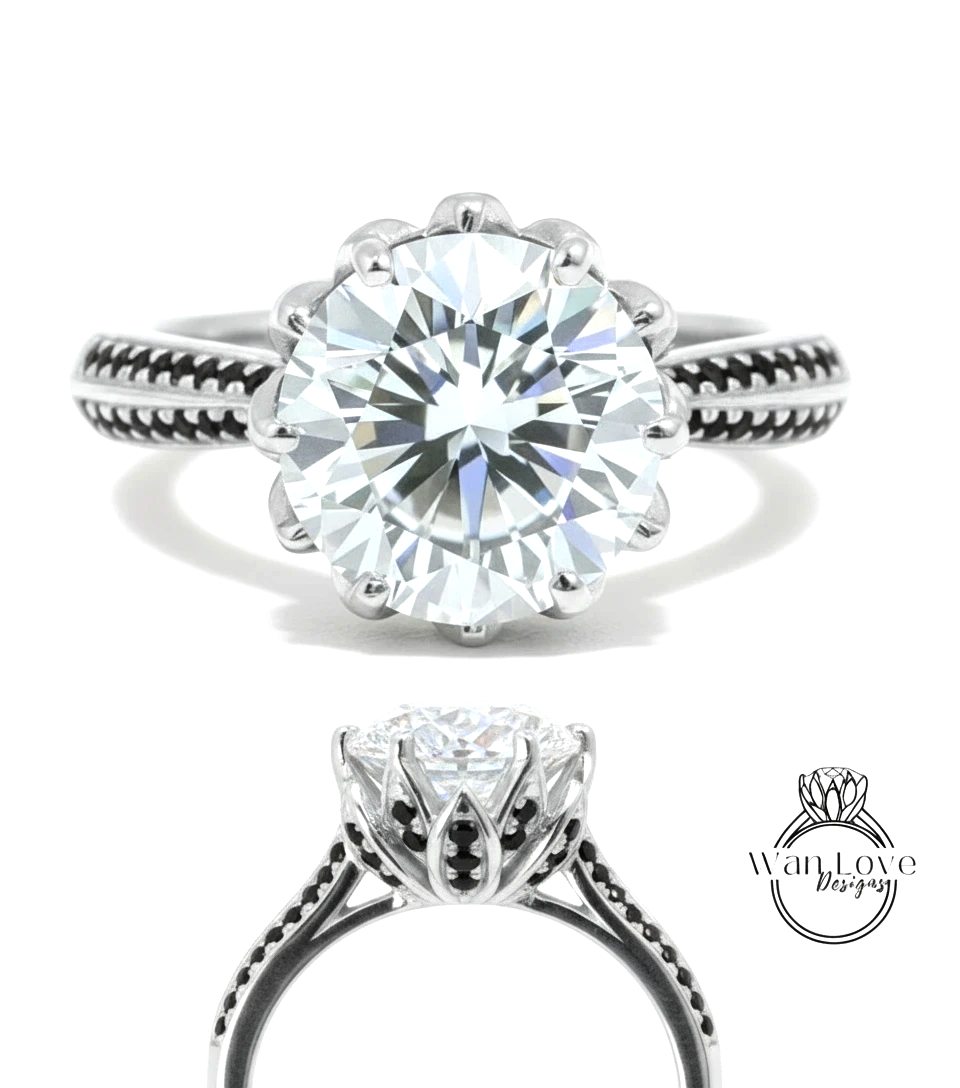 A stunning diamond engagement ring with a large round brilliant cut diamond set in a silver band adorned with black accents.