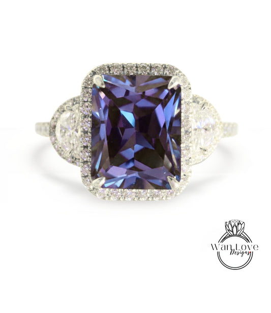 A stunning ring featuring a large, deep purple gemstone surrounded by a halo of smaller diamonds.