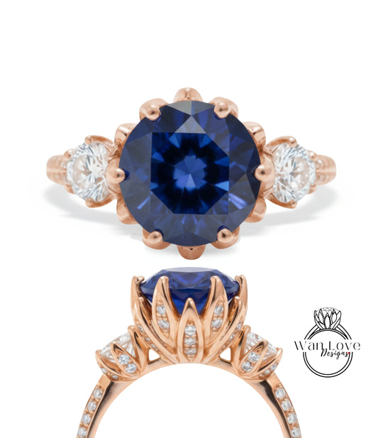 a beautiful blue gemstone ring with a large central blue gemstone surrounded by smaller diamonds. The ring is designed with a delicate floral pattern and has a rose gold band.