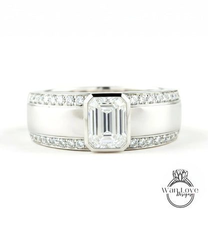 A close-up view of a silver ring with a large, clear gemstone set in the center.