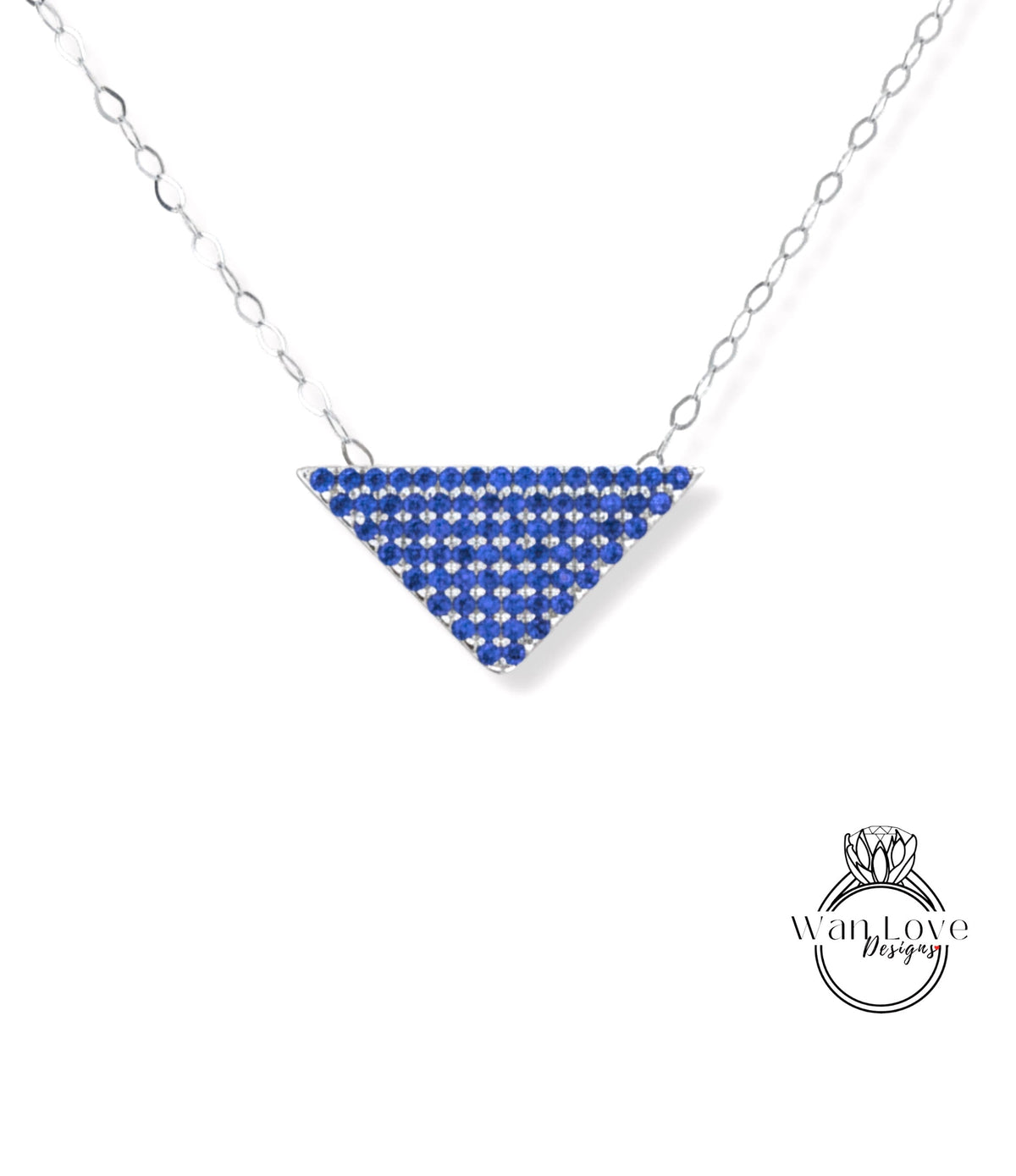 A necklace with a triangular pendant made of blue gemstones, such as sapphires or diamonds, suspended from a chain.