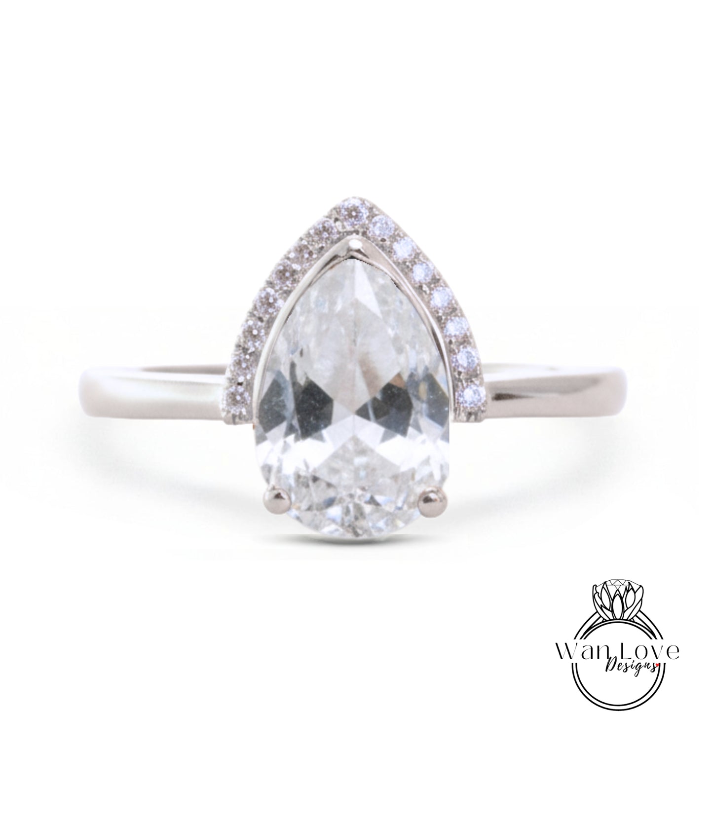 A close-up of a diamond engagement ring with a large, clear gemstone set in a silver band.