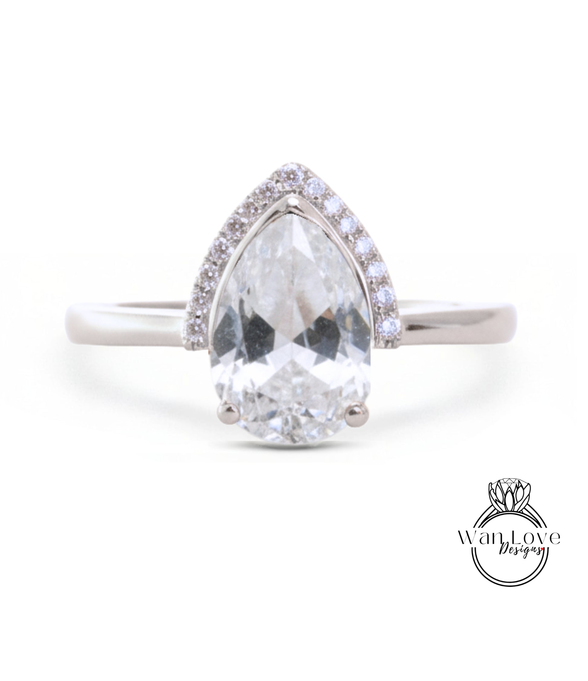 A close-up of a diamond engagement ring with a large, clear gemstone set in a silver band.