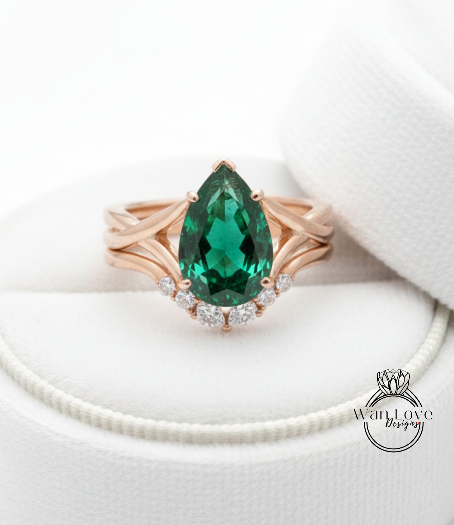 A gold ring with a large, green gemstone set in a diamond-encrusted band, placed on a white background.