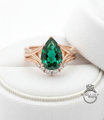 A gold ring with a large, green gemstone set in a diamond-encrusted band, placed on a white background.