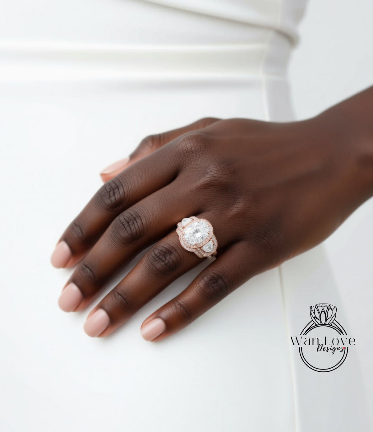 A close-up of a hand wearing a large, ornate diamond engagement ring.