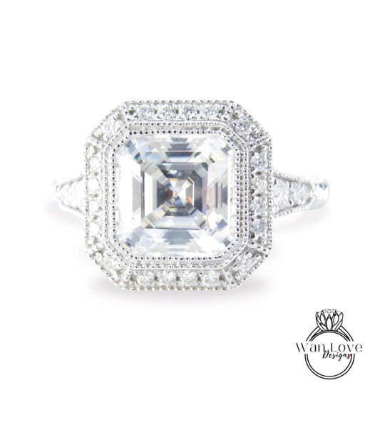 A stunning diamond engagement ring with a large, brilliant-cut diamond at the center, surrounded by a halo of smaller diamonds.
