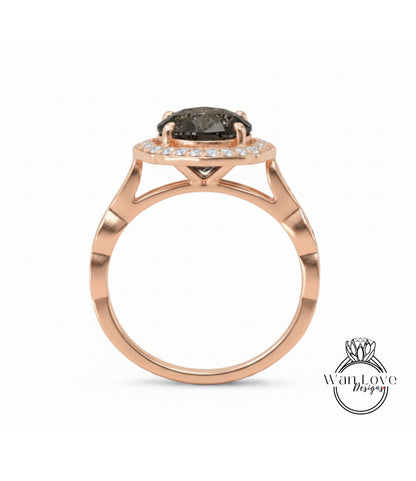 A rose gold ring with a large black gemstone in the center, set in a halo of smaller diamonds.