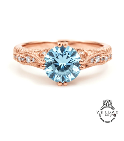 a beautiful engagement ring with a large blue gemstone set in a rose gold band.