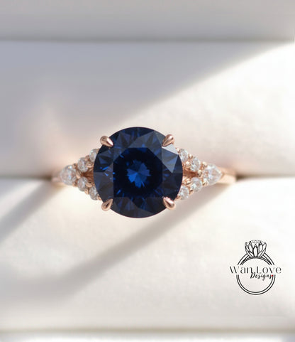 A close-up image of a gold ring with a large blue gemstone, showcasing the intricate details and craftsmanship of the jewelry piece.