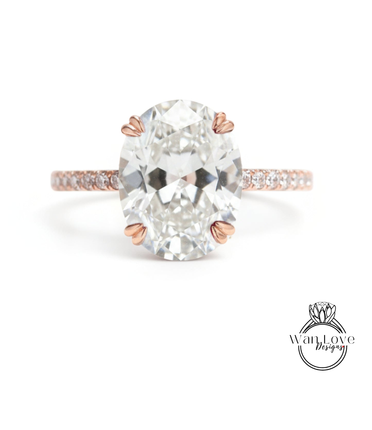 A large oval-shaped diamond engagement ring with a rose gold band and small diamonds set in the band.