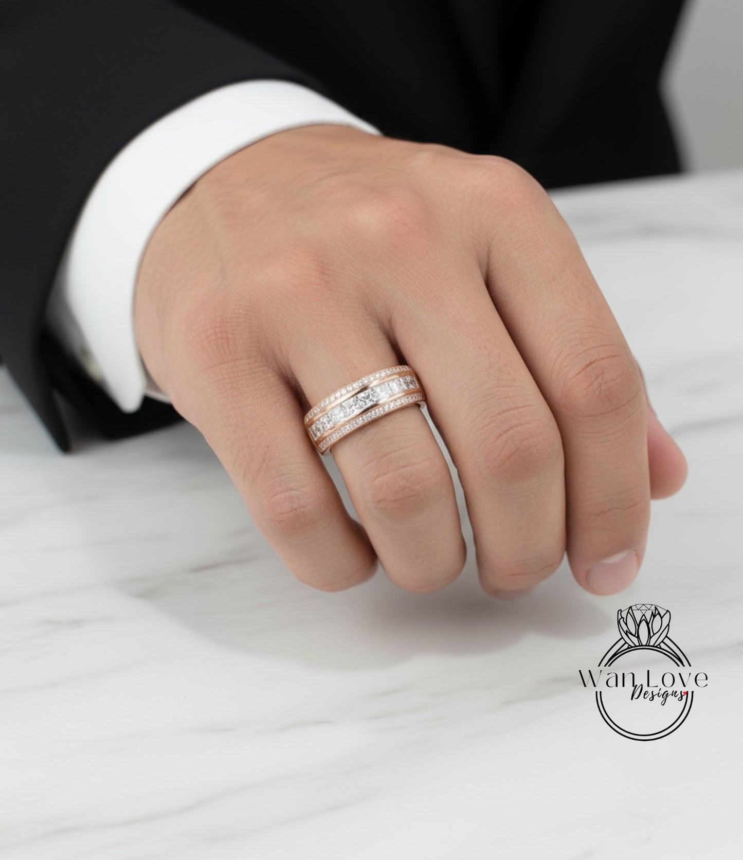 A close-up of a person's hand wearing a gold ring with multiple tiers of diamonds.