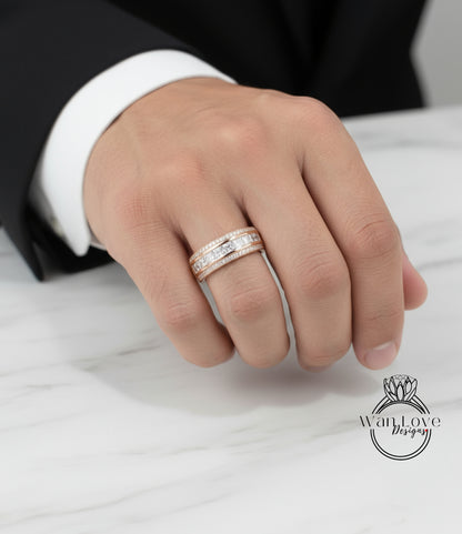 A close-up of a person's hand wearing a gold ring with multiple tiers of diamonds.