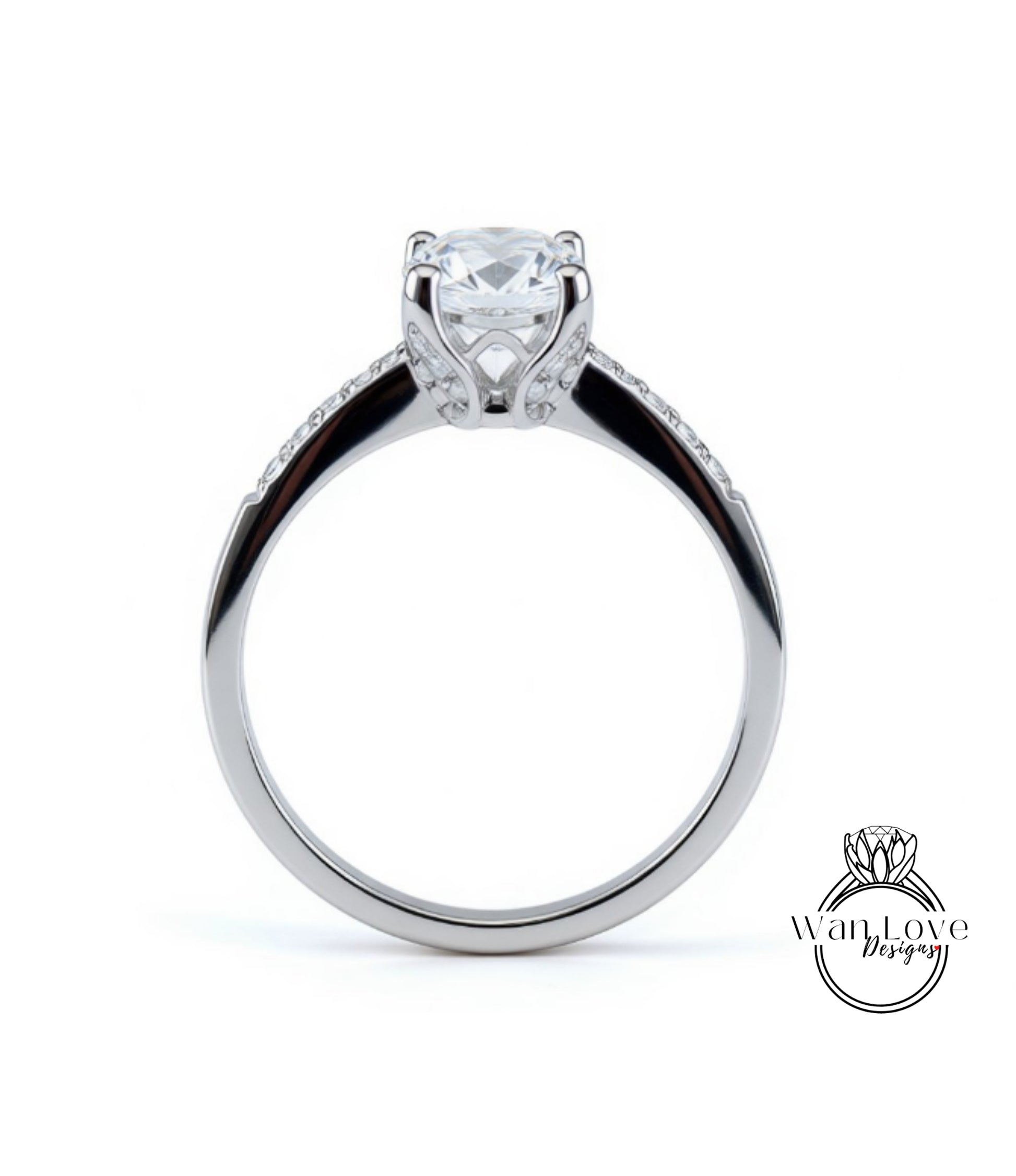 A silver engagement ring with a large central diamond and a smaller diamond accent on the band.