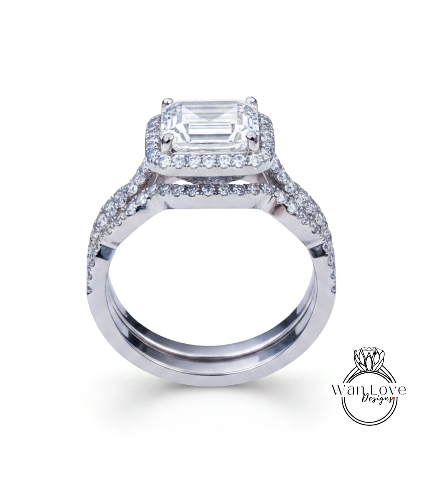 A stunning diamond engagement ring with a large central diamond surrounded by smaller diamonds on either side, set in a silver band.