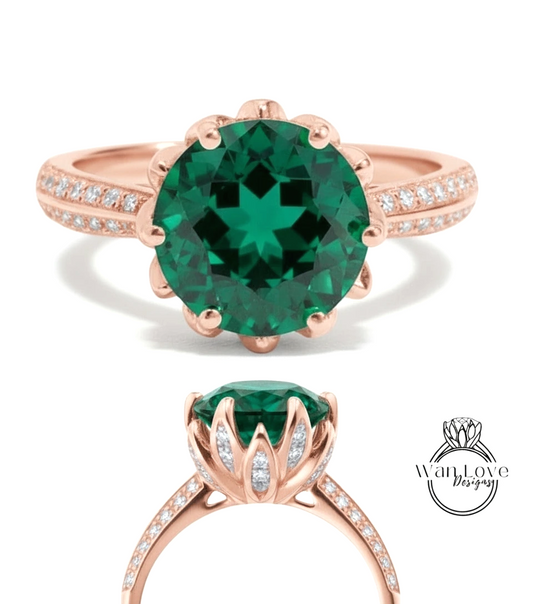 a beautiful rose gold ring with a large, vibrant green gemstone set in the center. The ring has a delicate floral design around the gemstone, adding elegance and sophistication to the piece.