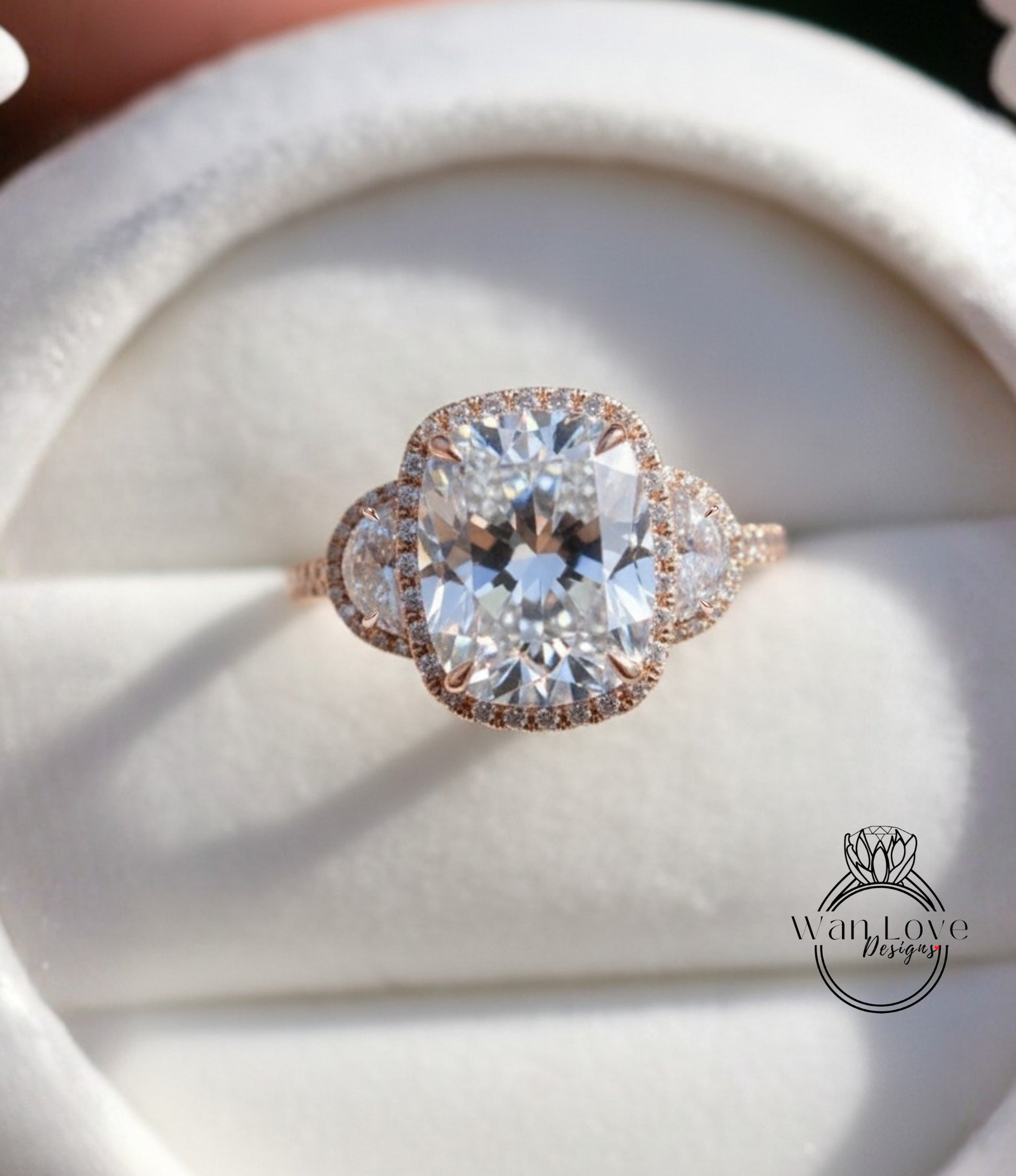 A close-up image of a beautiful engagement ring with a large, brilliant-cut diamond set in a halo of smaller diamonds, surrounded by a delicate band of gold.