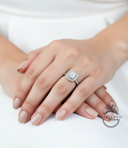 A close-up of a person's hands wearing a diamond engagement ring.
