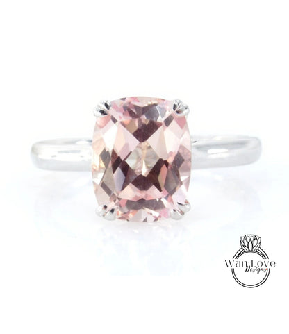 A ring with a large, pink gemstone set in a silver band.