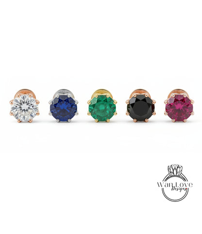 a collection of five diamond earrings, each with a unique color gemstone.