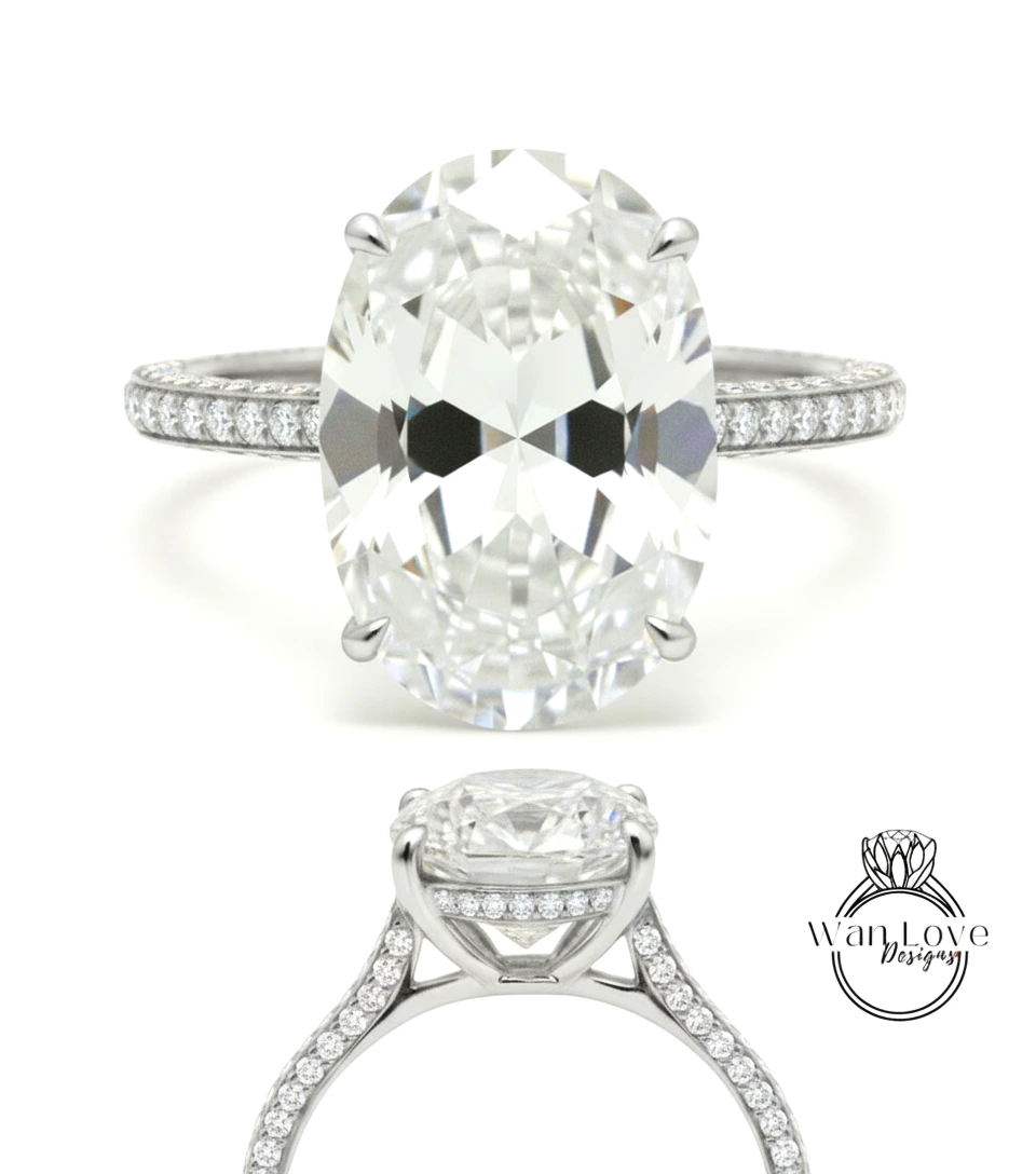 A stunning diamond engagement ring with a large oval-shaped diamond set in a silver band adorned with small diamonds.