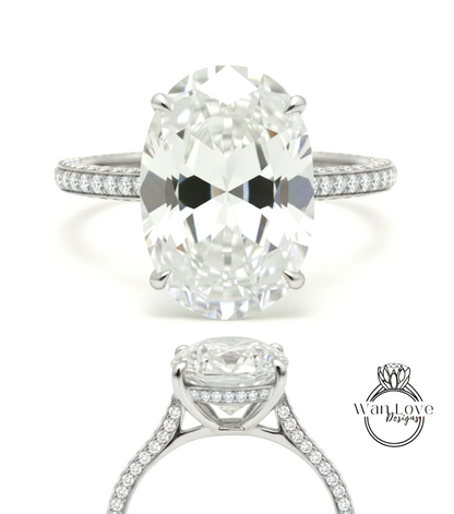A stunning diamond engagement ring with a large oval-shaped diamond set in a silver band adorned with small diamonds.