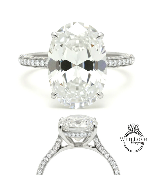A stunning diamond engagement ring with a large oval-shaped diamond set in a silver band adorned with small diamonds.