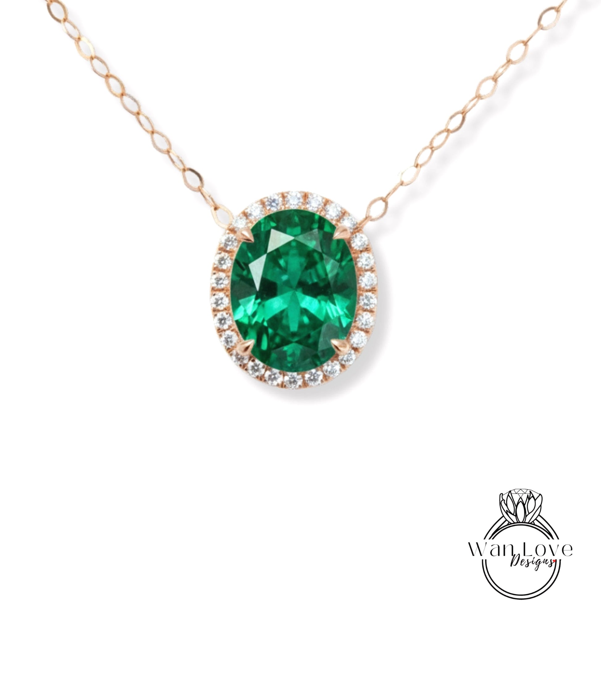 A necklace with a large oval-shaped green gemstone surrounded by smaller diamonds, set in a gold-toned metal.