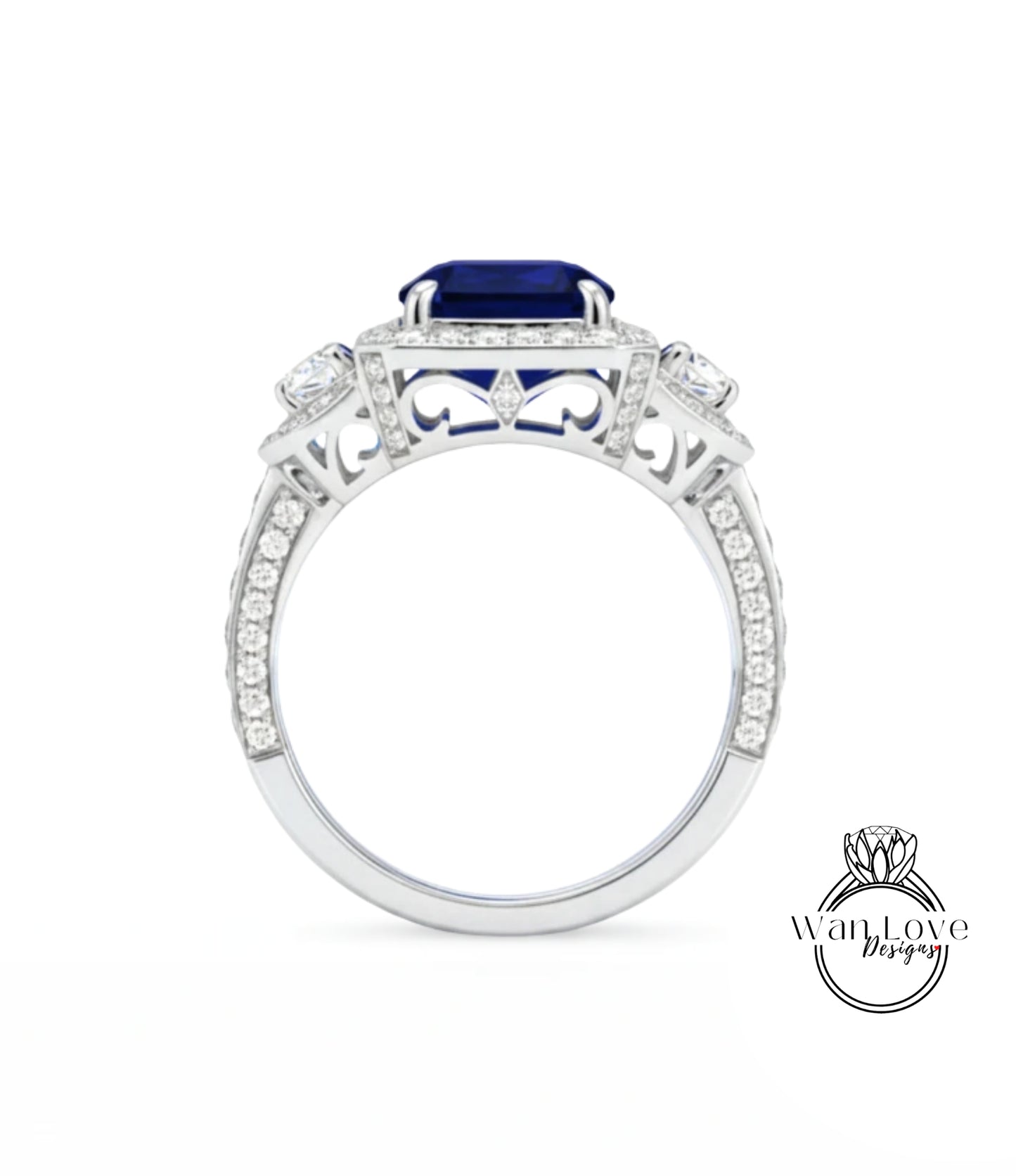 A silver ring with a large blue gemstone, likely a sapphire, set in a diamond-encrusted design.