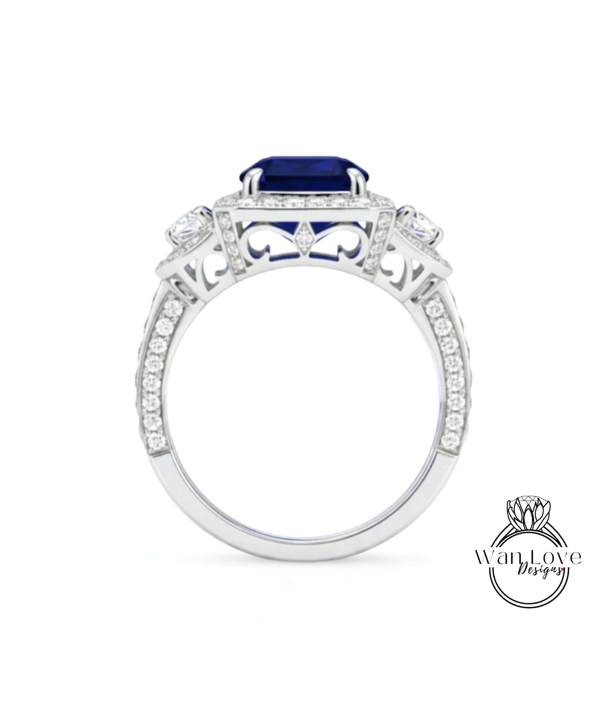 A silver ring with a large blue gemstone, likely a sapphire, set in a diamond-encrusted design.