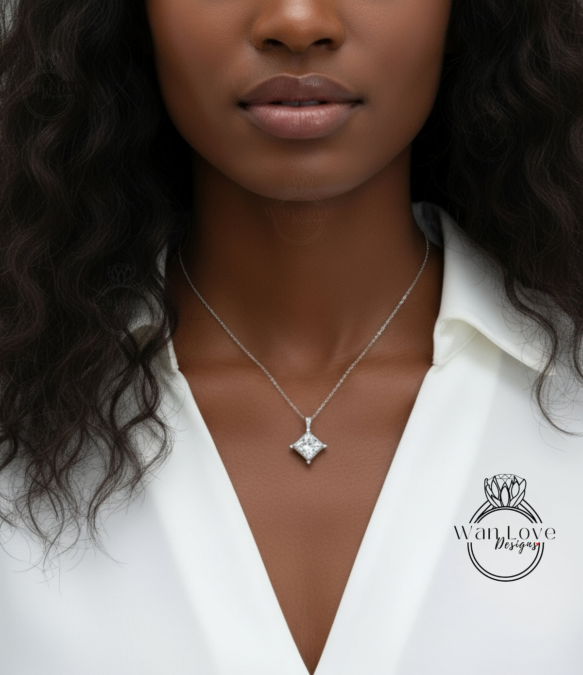 A close-up of a woman's neck and chest area, featuring a necklace with a pendant.