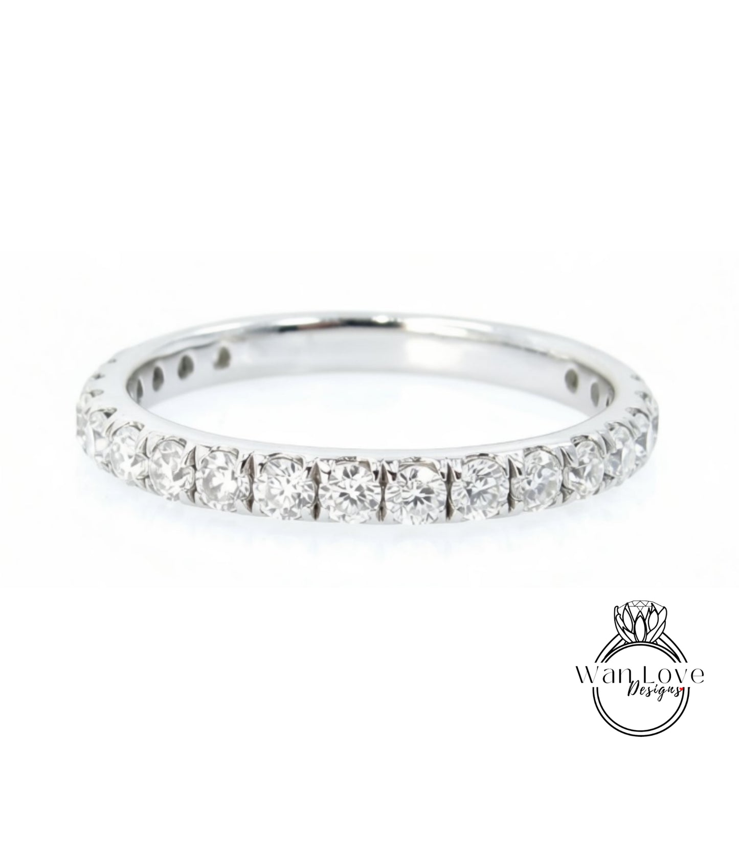 A silver band ring with a row of diamonds set in it.