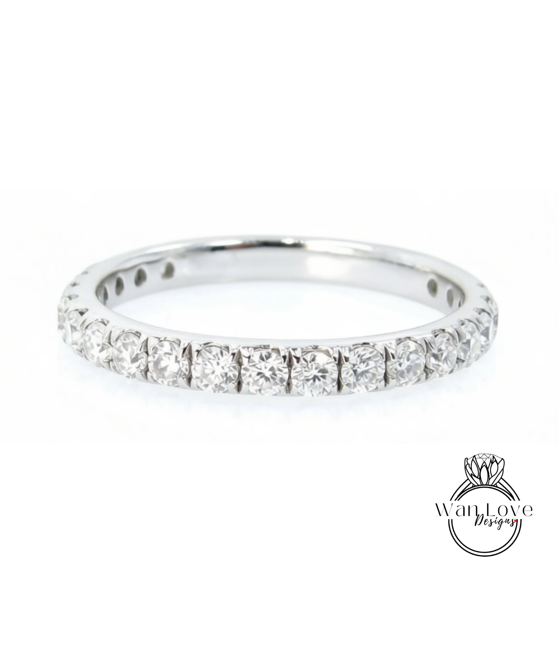 A silver band ring with a row of diamonds set in it.