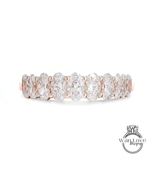 A row of oval-shaped diamonds set in a gold band.