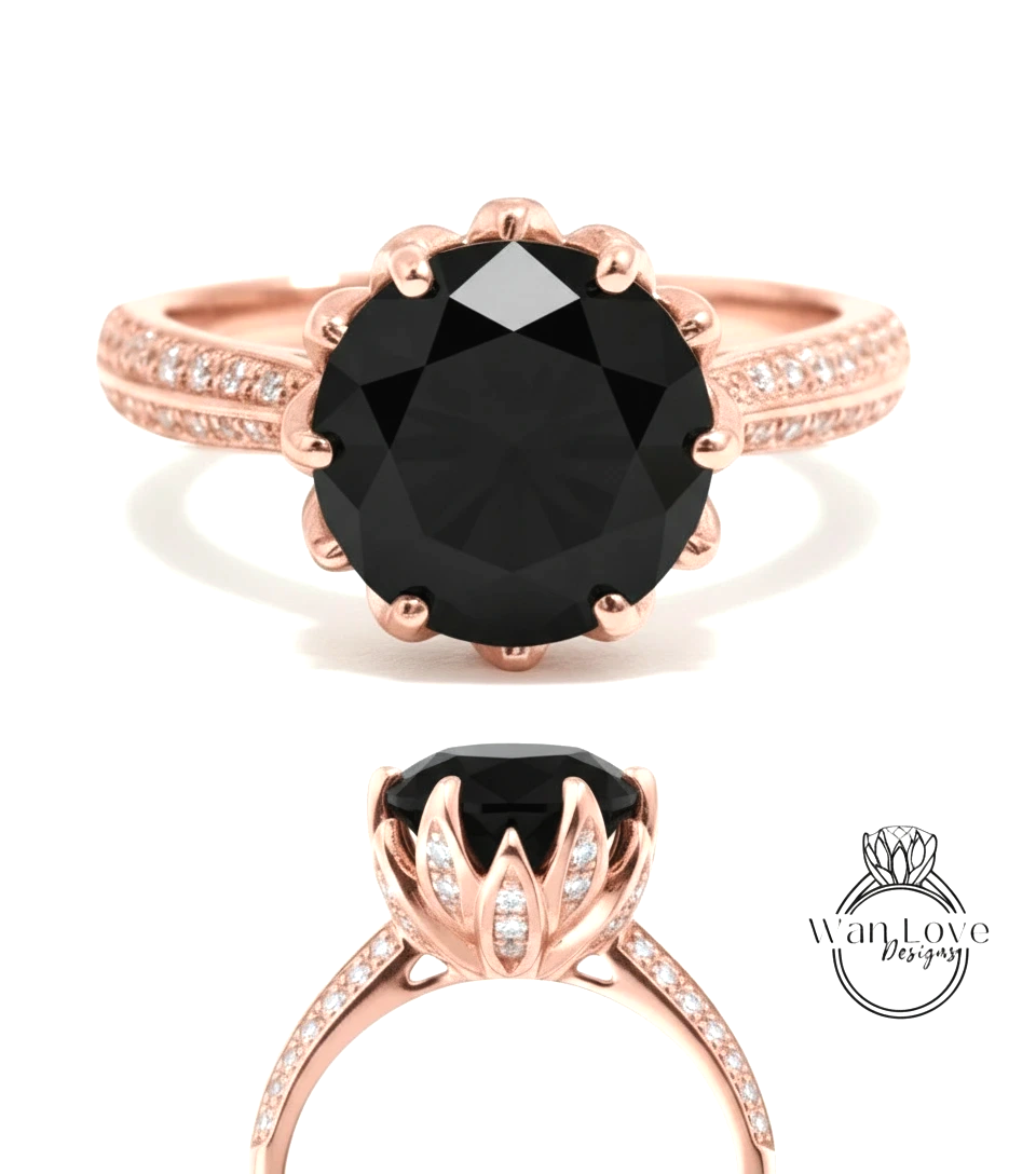 a rose gold ring with a large black diamond as the centerpiece. The ring has a delicate floral design around the diamond and is adorned with small diamonds along the band.