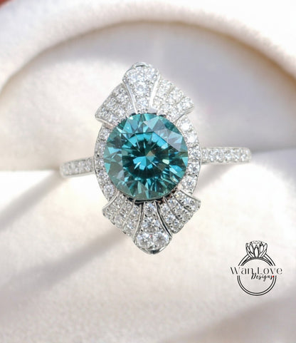 A close-up image of a diamond ring with a large, blue gemstone surrounded by smaller diamonds.