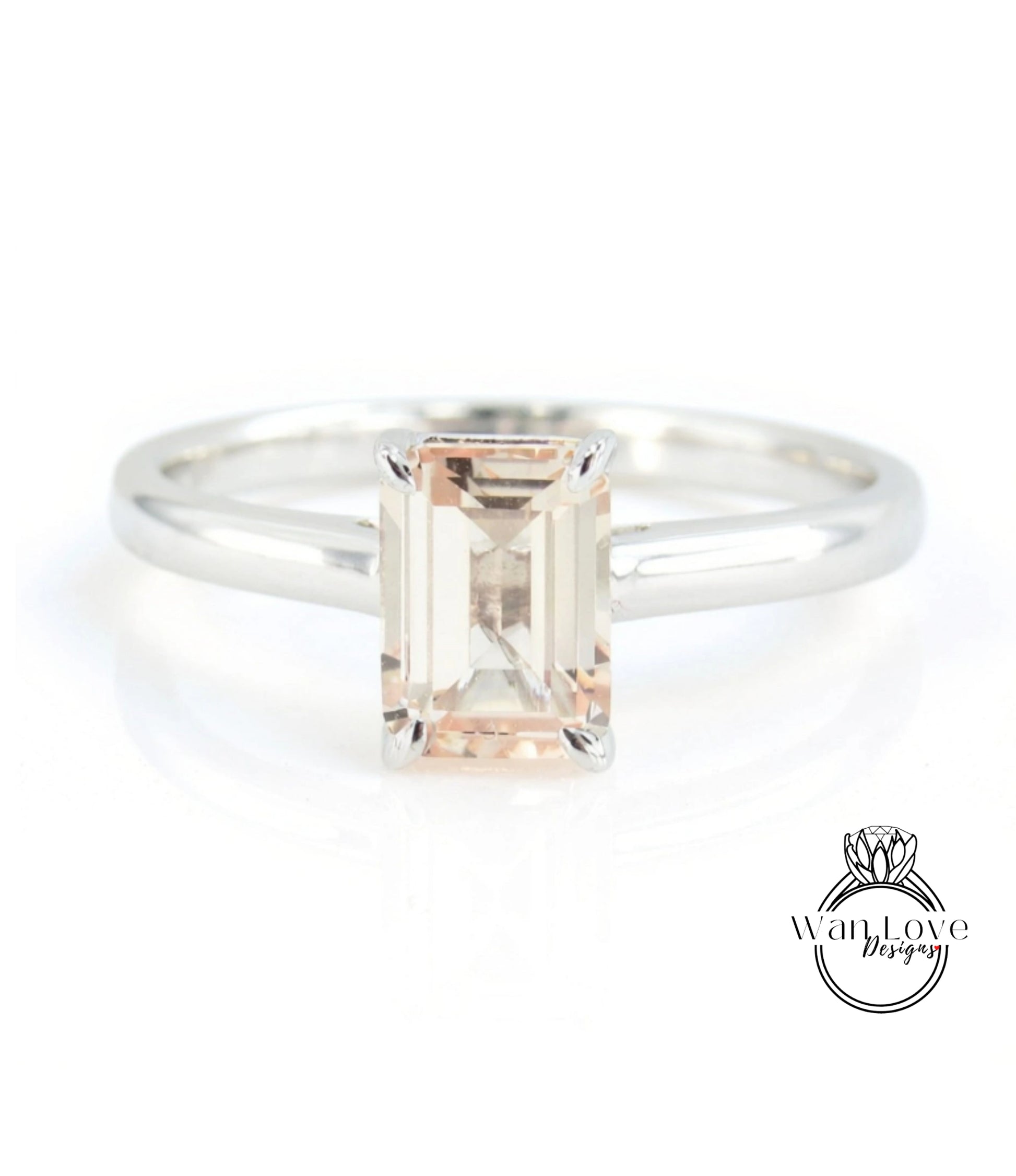 A silver ring with a large, rectangular-shaped gemstone in the center.