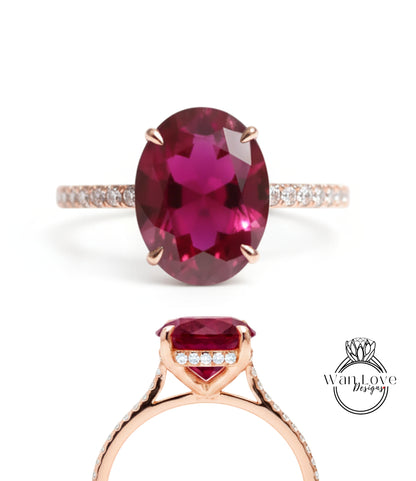 a beautiful pink gemstone ring with a large oval-shaped gemstone set in a gold band.