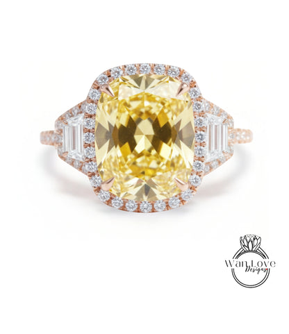 A large, yellow diamond ring with a halo of smaller diamonds around the center stone.