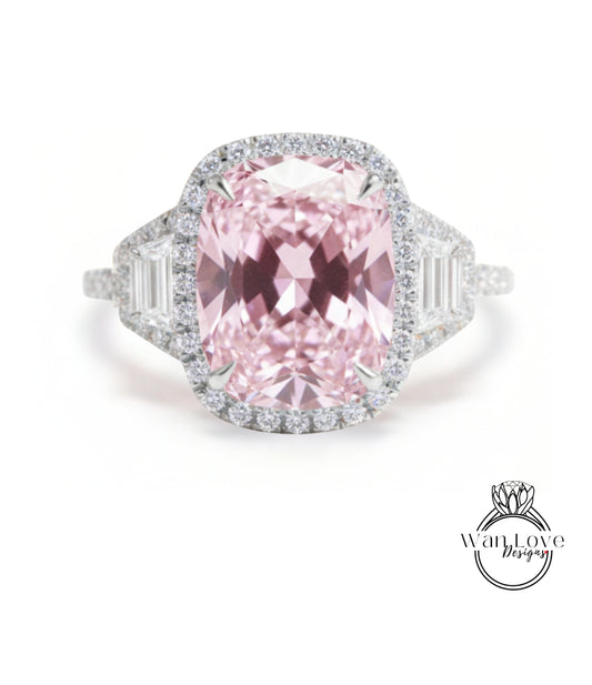 A stunning pink diamond ring with a large central gemstone surrounded by smaller diamonds set in a halo of smaller diamonds.