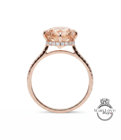 A rose gold engagement ring with a large round diamond set in the center, surrounded by smaller diamonds.