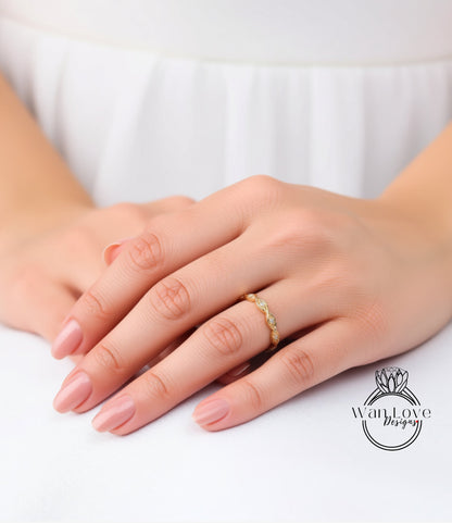 A close-up of a person's hands wearing a gold ring on the ring finger.