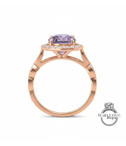 A rose gold ring with a large purple gemstone set in the center, showcasing the intricate design and craftsmanship of the jewelry piece.
